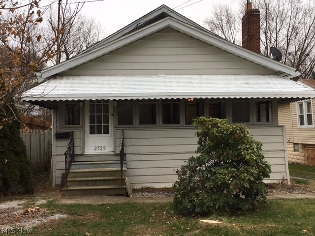 Pack your boxes! Move right in to this spacious 2 bedroom home, nestled between Firestone Park, Kenmore and the Portage Lakes. Conveniently located by Waterloo Rd, Manchester Rd and 277. This home has BRAND NEW windows, fresh paint and freshly cleaned carpets. Enjoy the neighborhood from the bright enclosed sunroom. Or bask in the privacy of the large back yard. Shoot some hoops or throw a party on the nice big deck. Driveway extends passed the house and around to the attached garage under the house. There is a nice bright living room with a fireplace, coat closet at entry way, full dining room and huge kitchen. Seemingly endless cabinets and counter space! Full sized gas range, built in microwave, refrigerator and dishwasher all stay. There's still a nice sized bathroom and 2 bedrooms on the main level. Downstairs there are 2 semi finished areas, with drywall on ceilings and walls. Utility room with furnace 2016 and hot water heater 2012, separate laundry area and access
