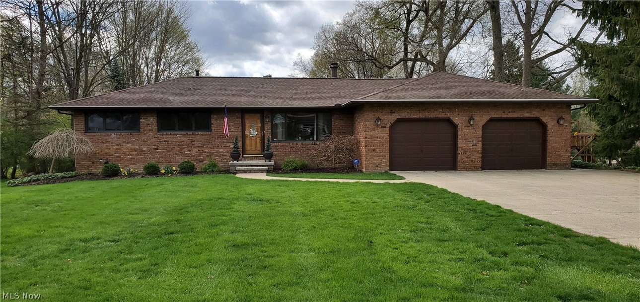 This meticulously cared for and updated 3 bedroom ranch is located on a 3/4 acre lot minutes from the bike and hike trail and a city park. As you enter the eat in kitchen with granite countertops, you will enjoy the views of the neatly manicured backyard. The lovely deck and raised patio can be accessed through the slider from the kitchen for entertaining. A formal dining area adjacent to the kitchen is also a convenient feature. The living room with fireplace and oversized windows, provides a gathering spot for family and friends. The generously sized master bedroom has plenty of closet space and an adjacent master bath. The other bedrooms have lovely hard wood floors. The designated office on the first floor allows for an at-home work space. The two car garage has a double long bay that can be used for storage or another vehicle. The finished recreation rooms and bath in the basement provide an additional 638 square feet of living space. The large exterior barn is a perfect storage a