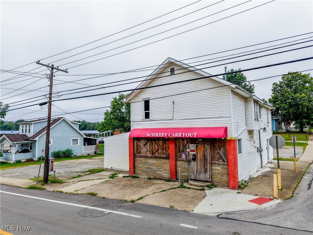This property offers a blank canvas on a busy street, a double corner lot with a large parking area, and excellent visibility. The building was previously used as a convenience store on the main floor, with a spacious apartment on the second floor. Inside is gutted and cleaned out, ready for your vision. Electric is currently on, and HVAC is in working condition. The property is zoned as R-2, but was previously grandfathered in as commercial. May be subject to a variance from the city of Parkersburg. The broker and property owner can make no guarantees of the success or failure of this variance. Please perform your own due diligence.