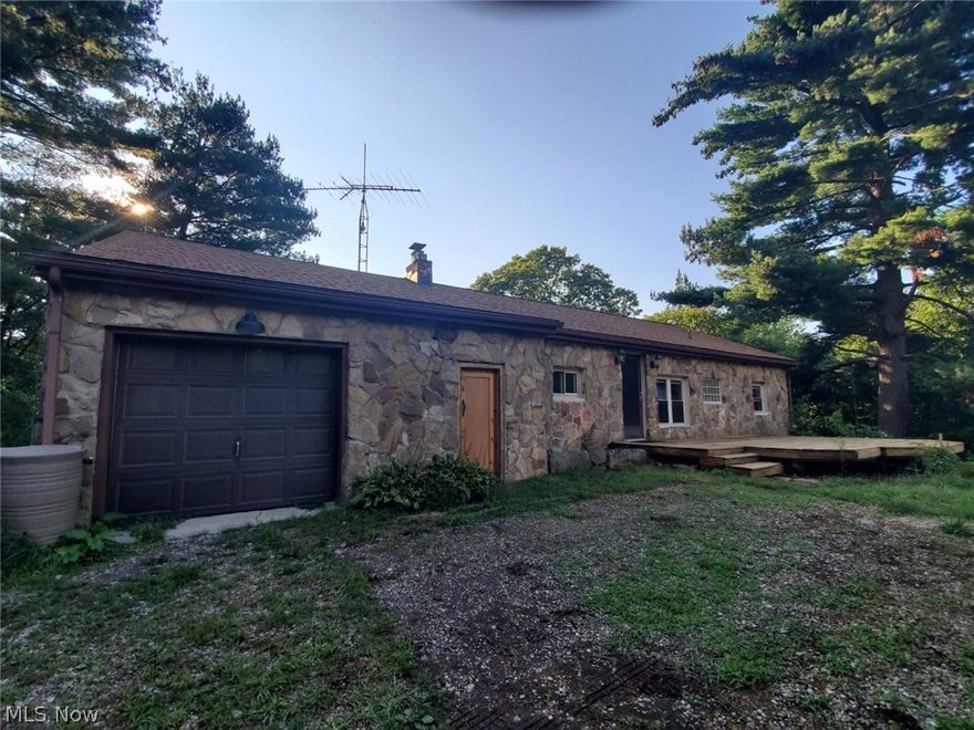 Country living with privacy and room to roam! Beautiful stone Ranch-style home with wood burner to add to the cozy feeling of the home. 24' X 24' outbuilding. $6.00 assessment from MWCD. Shared well and driveway.