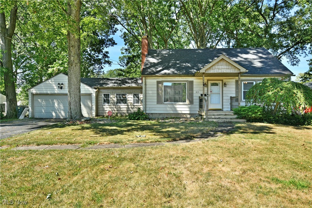 Find tons of style set beneath the trees with this stunning Warren Cape Cod, delighting with two floors of finished living space that fill its four-potential bedroom layout! Natural earth tones and shake siding compliment the exterior of this charm filled residence. A winding sidewalk finds a covered front porch as a two-car garage adds to the curb appeal. Towering trees create a shaded, park-like atmosphere that continues into the must-see backyard. Here, multiple patio spaces include a tiered deck that allows you to take in the views with ease. Inside, a open central living room boasts dark, hardwood flooring as the prominent fireplace joins a French door partitioned dining room. Peering down into the sunken dining area highlights stunning wood beams and decorative lighting while both garage and central patio entrances await. Meanwhile, a spacious kitchen brings shimmering stone countertops and contrasting white cabinetry. Eat-in dining space is available in the corner while a separate rear sunroom opens onto the deck. Down the first-floor hall, a pair of impressively sized bedrooms join a deep-set full bath and its stylish vanity with accenting tile work. Upstairs, faux stone walls line the wraparound landing as the third, loft style bedroom brings carpeted flooring. A fourth potential bedroom completes the floor with its cozy footprint and adjoining walk-in closet space.