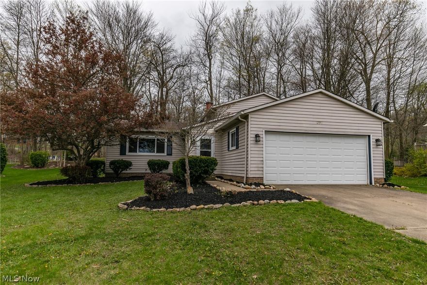 Wow, this home is fantastic! This split level home located in Twinsburg has all been updated and is ready to move in! The front room has a beautiful picture window that allows for an abundance of light to shine in. The updated kitchen features stunning subway tile, that accents the white cupboards, splendid granite countertops and stainless steel appliances. The dining area not only has a sliding door that leads to the patio but also overlooks the family room. The family room is the perfect entertaining area with a rustic fireplace, amazing chair rail and do not miss that bar! This will be the entertaining spot in your home! Three nicely sized bedrooms with fresh paint and one boasting two closets! Fresh paint through, new flooring throughout, new electric panel and new water tank. Do not miss out this beautiful home!