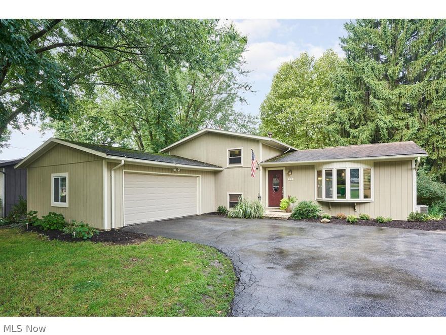 WOW! This sprawling split level has it all- 3 large bedrooms, 2 full bath rooms, 2 spacious living rooms, 2 car attached garage... the list is endless. Entering the front door you are welcomed by a totally open living room, kitchen and dining area. The first level also has updated hardwood floors, beautiful fireplace, granite counters and updated cabinets. The lower has a wood burning fireplace, a huge mud/ laundry room and a full bath. This split level also has a basement- which is perfect for storage, a work shop or work out room. The upstairs has 3 good size bedrooms and bathroom with a huge tub- plus his and her sinks. The lot is HUGE- almost a half an acre and the backyard is fenced in, with a shed. Enjoy your evenings or weekends on the huge, multi-level deck! Don't wait, come see this beauty today!