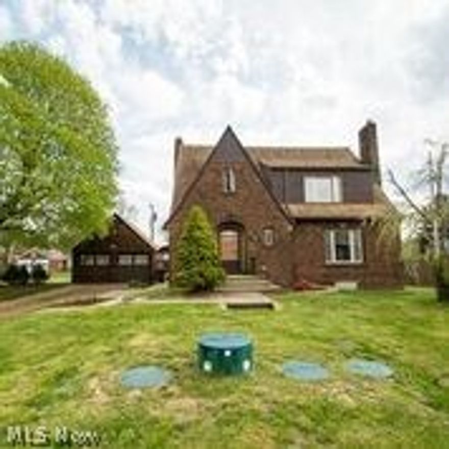 Beautiful French Tudor. Large kitchen, fully appliance. Two car detached garage. Two parcels. Large dining room open to living room with wood burning fireplace. Three bedrooms, finished basement, newer glass block windows, updated bathroom.  Above ground pool.