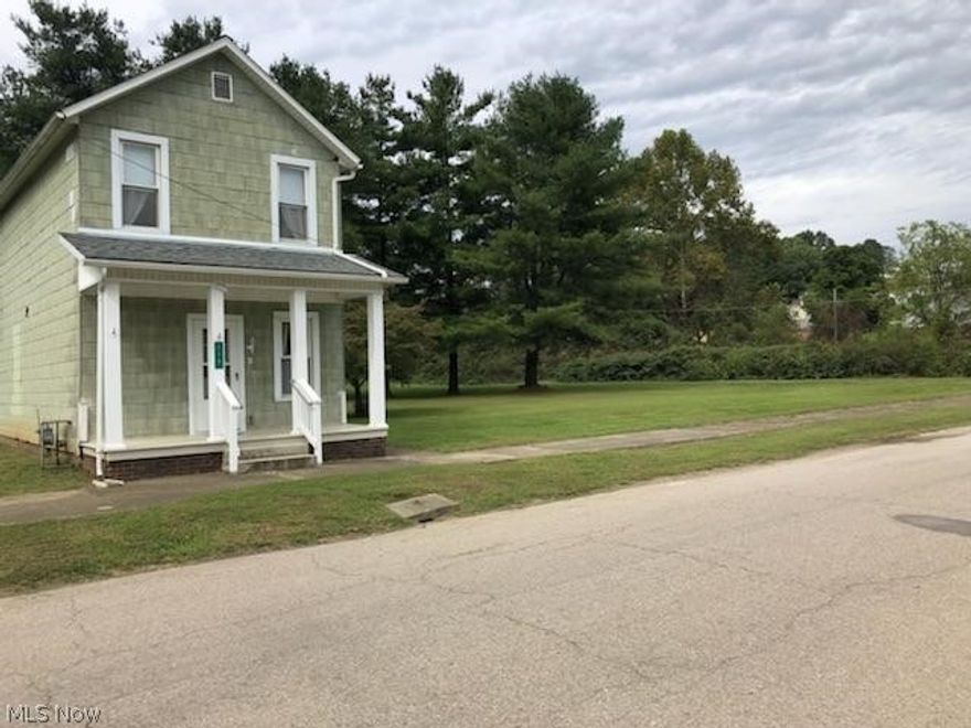 This loved and well cared for home is move-in ready and ready for its next family.  Offering three upstairs bedrooms, first floor full bath recently remodeled as well as a separate, spacious first floor laundry room/mudroom.  Kitchen also recently updated with new cabinetry and counter-tops.  Newer roof and furnace. Property includes 4 additional lots which offer a large, flat yard for the kiddos or pets to enjoy.