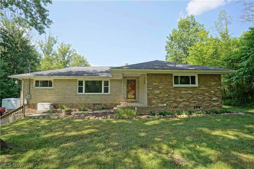 Do you need a separate "in-law suite" or full apartment?  Do you want privacy and a few acres?  If so, you have just come to the right house! Click the link above that will take you to a 3D virtual tour of the home.  This lovely ranch offers 3 bedrooms upstairs (owners suite has a half bath), and an additional bedroom and living space with a kitchen off the garage on the lower level.  There is a fireplace in the eat in kitchen. An office off the kitchen keeps the new "work from home" people quiet away from the rest of the house, yet close enough to multi-task.  How about the bonus that the house gets free gas since there is a gas well on the property?  It also feeds a natural gas home generator that comes with the home!  The current owner made many repairs and changes to the home since they bought it. Here is your opportunity to get county living, yet stay close to everything.