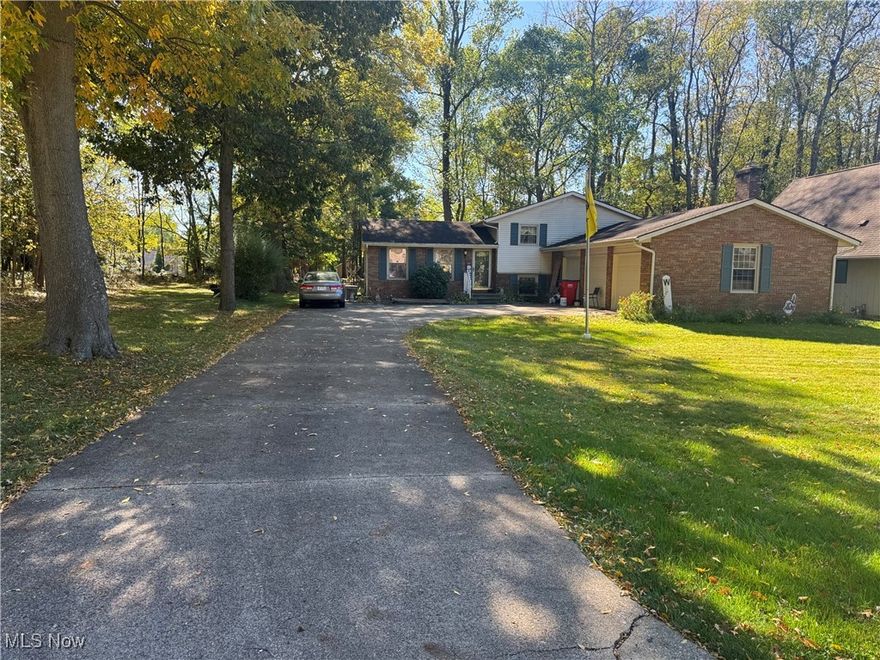 REAL ESTATE AUCTION - TUESDAY DECEMBER 2nd @ 4pm. 3 bedroom home, 2 full baths, 3 car garage on a private 1/2 acre lot in plain local school district. Take Cleveland Ave  N.W. to Greenway S.E to Meadow Lane Dr SE to  Grassmere, the house is on the left at the end of the street. The brick and vinyl-sided split-level home features three bedrooms and two full baths on a spacious half-acre lot with a three car garage with an entrance to the lower level. The property is situated on a quiet street and offers a combination of classic brick and low-maintenance and private back yard. There is additional parking on a full concrete driveway, and a generous yard with a cemented patio. The main level offers an inviting, light-filled living room and kitchen that flows into an open dining area with sliding glass door to private back yard . The lower level includes a cozy family featuring handcrafted mantel brick fireplace and wood-burning insert that efficiently heats the home, a laundry room with a convenient walk-up to the garage, and a walk-down to a basement area providing ample storage and utility space. Mechanicals are less than eight years old, offering peace of mind and efficiency. The home offers solid construction and generous space throughout, in need of cosmetic updates, providing an excellent opportunity to personalize and make it your own. Conveniently located near shopping, restaurants, and expressways near Belden village area. Bidding to be live and on-line bidding available. All information contained here and was derived from sources believed to be correct. Information is to believed to accurate but not guaranteed.