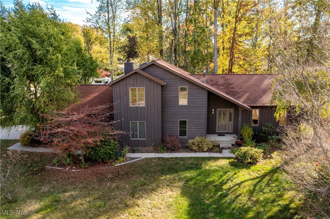 Beautiful contemporary colonial home nestled on TWO PARCELS! House is situated on Loyola and there is a second parcel (buildable lot) on Pepperdine Drive! Rear wooded parcel has 75ft of frontage and the main parcel has over 75 ft of frontage! with 125' of depth! Great curb appeal with rustic appeal! Recently repainted exterior. Step into a spacious entry foyer with vaulted ceilings and fresh paint! Large living and dining room offer crown molding and fresh, neutral paint + carpet was just installed! Beautifully designed kitchen with a soaring vaulted ceiling complete with skylight, center island cooktop, wall oven! Patio door (replaced in 2015) leads to a custom built deck with built in gas grill/line. The family room is VERY cozy and spacious with a fireplace and built in cabinetry. Main floor bedroom/full bath is a great option for teen/in-law suite type setup. HUGE laundry/mudroom.  Upstairs you'll find three bedrooms and two full baths. The Primary bedroom suite is spacious. There is a walk in closet with custom closet organization. You'll also find a VERY SPACIOUS primary bath with a recently updated walk in shower, floor and a double vanity! That's not all! There is a finished basement with a rec/bonus room! Side load garage and a storage shed. ALL APPLIANCES INCLUDED!  Other notable (estimated) dates seller is able to provide include roof '12, central air '24, insulation and furnace '16, garage door and opener 2024! Often desired location placing you within minutes of LCCC, shopping/health services, parks and a short distance from I-90/254!