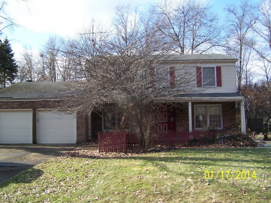 Spacious 4 bedroom colonial. Modern kitchen & baths, some hardwood floors plus large Florida room, brick patio on wooded lot. Front entry foyer and divided semi finished basement.