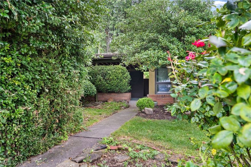 MID CENTURY ranch architecture features angular details, flat roof and an asymmetrical profile. This modern living space has expansive walls of glass, clean lines and an open floor plan which are the hallmark of this design. The home is both practical and aesthetically pleasing. Inviting corner lot offers a private setting with mature landscaping and gardens. Updates include interior painting, lament flooring and carpet, bath with floating vanity and handsome tiles, lighting and tiled basement. Pavilion style garage leads to covered side entry. Owner relocated and available for IMMEDIATE POSSESSION. Roofing allowance and HOME WARRANTY