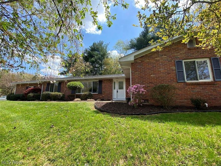 Remodeled top to bottom!! Complete interior transformation in this spacious brick ranch in North Hills in Marietta.  This four bedroom, two bath home offers open entry to the living room and dining area, remodeled kitchen with island and attached family room, remodeled bathrooms, new flooring and light fixtures throughout the entire home, newer furnace and air conditioning unit.  The lower level was finished into an office and rec room.  Other amenities include new roof in April 2021, spacious closets, attached two car garage, nice landscaping and large lot with woods at the rear.  Come see this home and make it your own!