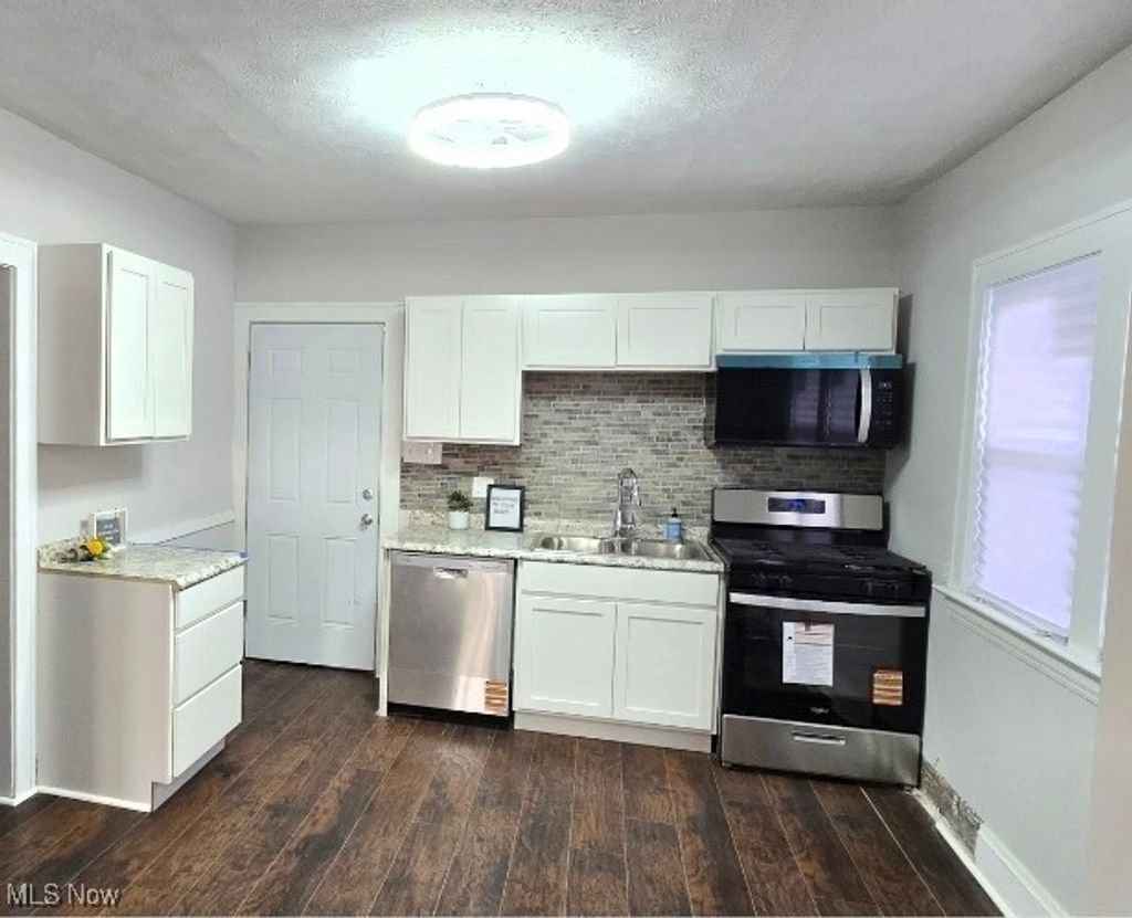 Photo of 10909 Nelson Avenue, Cleveland, OH 44105 (MLS # 5174402)