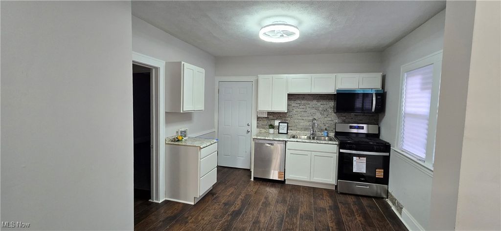 Photo of 10909 Nelson Avenue, Cleveland, OH 44105 (MLS # 5174402)