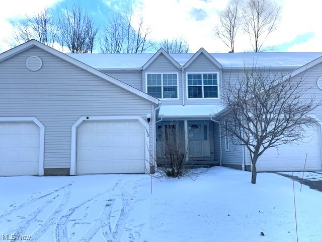 Wonderful townhouse condo in Streetsboro features a Great room with Liv/DR combo with sliders out to the deck with a wooded view, full applianced kitchen and half bath on first floor. Two nice bedrooms with vaulted ceilings and full bath on 2nd floor and a finished lower level family room, full bath and laundry. All new flooring was just added within the last few months. A bright and neutral decor and 1 car garage are also present. Just move in and enjoy!