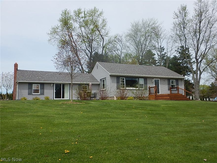 Wonderful country setting with your own spring fed stocked pond on 3 acres!! Picture window in living room has a great view of the pond. Updated kitchen with maple cabinets, corian countertops and laminate flooring, family room with a slider to a patio a great place to relax and enjoy the view! Walk out basement with glass block windows.  Updates to the home include vinyl siding, windows, light fixtures, treated wood front porch, blown-in insulation, six panel doors, original refinished hardwood floors in living room and bedrooms. One car attached garage and 22 x 28 outbuilding with electric has tons of storage perfect for a home based business or for all the toys you may have. Family room could be converted into a 3rd bedroom. This a great place to call home!