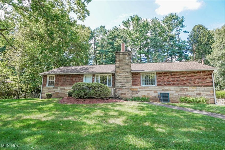 This all brick ranch in North Canton offers so much to love! The spacious eat-in kitchen is the heart of the home, providing ample cabinet and counter space with room for casual dining. It’s perfectly positioned between a welcoming living/dining room featuring a fireplace with stone surround and a cozy den with knotty pine walls and a beamed ceiling. Step out to a bright 3-season sunroom that overlooks the tree-lined backyard with a deck for soaking up the sunshine.

All bedrooms are conveniently located on the main floor, including one with built-in shelving and storage, along with a full bath. The lower level offers extra entertainment space in the rec room, complete with a bar, sitting area, and another full bath. This level also includes the laundry room and access to the built-in one-car garage.

Situated on nearly half an acre, this home has a fantastic setting with ample parking in the stamped concrete drive. Plus, you're just a short drive from parks, walking trails, and all the amenities North Canton has to offer. Schedule your showing today!