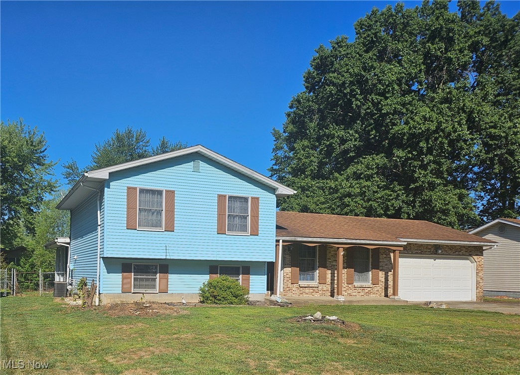 This Split Level comes with so much potential to create your own dream space. Three bedrooms, 2 full baths and an optional Bonus room to turn into whatever suits your taste. The family room has a wood burning fireplace with exposed wooden beams. A dining room with an attached 3 season room with surrounding full length windows. There is a private cement patio in the back. The basement is waterproofed and is warranted by Ohio State Waterproofing. Roof in 2016, HWT 2025, C/A 2016, Furnace 2019,new gas dryer line, new dishwasher (not installed). All new Laminant flooring.