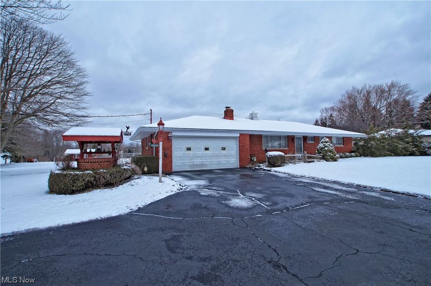 All Brick 3 Bedroom / 2.5 Bath Ranch on over 6 acres that could easily accommodate horses* Lot's of living space featuring a Formal Living Room w/ Sandstone Fireplace and a 24' x 18' Wood Beamed Family Room w/ Wood Burning Stove that over looks this beautiful property* Eat- In Kitchen* Dining Room* Master Bedroom w/ Full Bath* 3 Season Sun Room* 2 Large Out Buildings* Shed and Lean-to* Fenced in area for your vegetable garden and a large Pond* The home has the conveniences of City Water and Natural Gas Heat* Close to the Interstate and Shopping, but with that Country Living Charm* Bring your flair for decorating and make this well cared for home yours* Call for your private showing today*