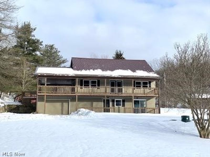 Gorgeous contemporary style home on 2 acres with a pond. This home has been completely remodeled inside and out. There are 3-4 bedrooms, 2 1/2 baths, a full walk out lower level, and an oversized 1 car attached garage. The location is ideal being just outside of town and a short distance to the expressway and the local lakes. There is a 16x28 covered wrap around porch that leads to the private back deck. The great room has a stone fireplace and cathedral ceilings. The kitchen is open to the great room and has custom soft close cabinets. There is a patio door off the dining area that leads out to the deck. Upstairs is the master suite with a walk in closet and private bath. There is a bonus room that could work as a home office or possible 4th bedroom if needed. The lower, walk out level has a nice size family room, 2 additional bedrooms, a brand-new full bath, and a large laundry room. There are patio doors off the family room that take you out to the lower patio. There is a brand-new