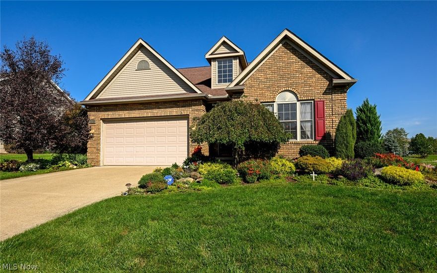 Beautifully tended Villa in the desirable Mudbrook Village of Jackson Township! Upon arriving to your open corner lot, you are welcomed with gorgeous landscaping boasting of coralbells, mums, a weeping cherry tree, japanese maples, and ground cover that changes with the season bringing all the colors Ohio has to offer. Entering the home, you are greeted with the Great Room’s 13 ft cathedral ceilings, Dinette and Kitchen seamlessly flowing into each other. The kitchen is perfect for entertaining with new laminate flooring, stainless steel appliances, dark accent corian countertops, attached breakfast bar, full pantry, and plenty of storage in your maple cabinets. Enjoy coffee and a good book in the four season-sunroom, and then relax out back on the private patio. The spacious master bedroom has an ensuite with a quartz countertop and full size walk-in shower. A convenient first floor laundry is located off the kitchen. The full basement waiting for your personal touch and a two car gar