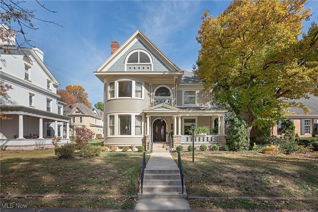 For Sale: Timeless Queen Anne Home in Marietta, OH
316 Fifth Street, Marietta, OH
5,226 Sq Ft | 5 Bedrooms | 3 Floors | 2-Car Garage
Step back in time and experience the elegance of this 1899 Queen Anne masterpiece nestled in one of Marietta’s most sought-after neighborhoods. Spanning over 5,226 square feet, this exceptional home seamlessly blends historic charm with gracious living.
Exterior Features:
• Classic arched entrances, ionic columns, and palladium windows
• Distinctive curved bay windows and rooftop pediments
• Beautifully preserved architectural detailing
Interior Highlights:
• Grand wainscoted reception foyer with ornate columns
• Sweeping oak staircase crowned by a striking stained glass oculus window
• Rich oak woodwork flows through formal living and dining spaces, evoking timeless craftsmanship
Outdoor Amenities:
• Charming carriage house-style 2-car garage
• Antique brick-paved courtyard garden framed by sandstone terraces—perfect for relaxing or entertaining
This rare gem offers an unparalleled opportunity to own a piece of Marietta history. Ideal for homeowners who value architectural integrity and refined living.