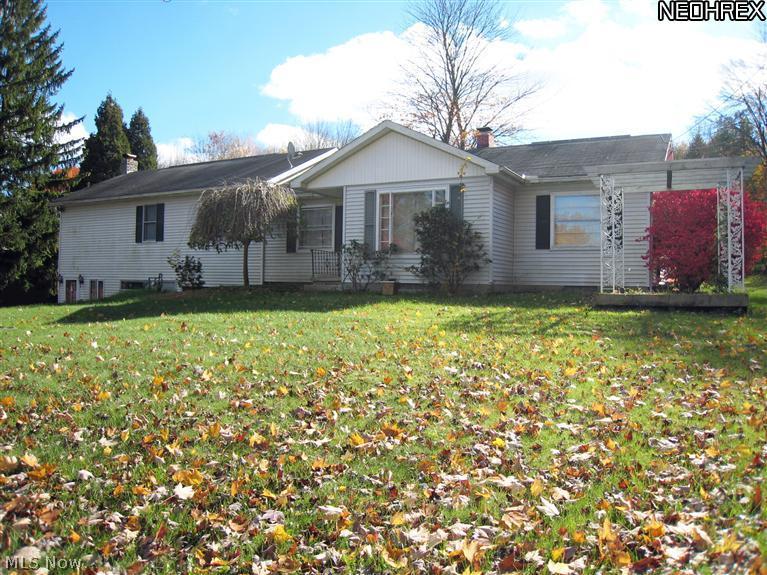 Location, Location, Location! Take a look at this raised ranch on a quiet street in Bath Twp just minutes from everything in Fairlawn. All 5 bedrooms are on the 1st floor including the master suite with master bath and walk-in closet. Kitchen has been updated with lots of cabinets/counter space, an eat-in area and opens to a larger dining room. Grand staircase connects the 1st floor to the lower level which features an enormous unobstructed 35'x22' finished rec. room complete with a wood stove, perfect for entertaining large groups! 2 car detached garage & large multi-tier deck which provides a great outdoor space to enjoy the private and spacious backyard. Newer high-efficient furnace. Copley/Fairlawn Schools.