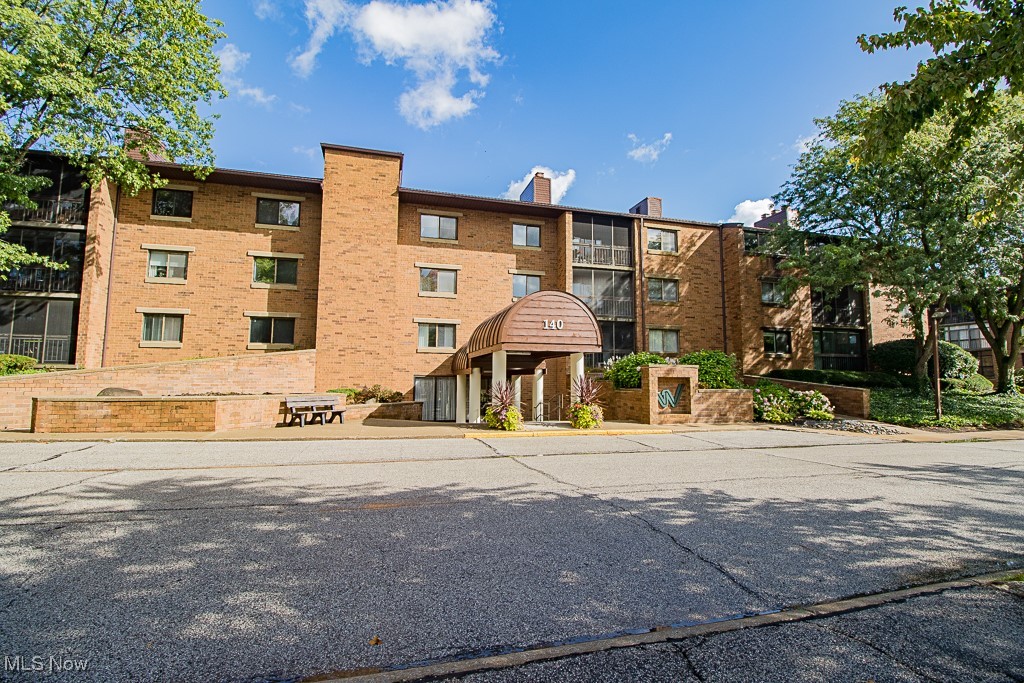 This Woodhawk Condo is move in ready! This spacious 2-bedroom, 2-bath ranch-style condo offers 1,560 square feet of one-level living on the second floor. Neutral decor throughout. Enjoy the fireplace on a winter evenings. The dining room offers space for more formal dining and entertaining or can easily serve as a home office, sitting area, to suit your lifestyle. Enjoy the screened-in balcony—with your morning coffee, evening cocktails, or the calming sound of rain. The specious primary suite features mirrored closets and a private en-suite bath with a convenient tub/shower combination. The second bedroom offers flexibility as a guest room, office, or study. A full hall bath is easily accessible for guests. All appliances, including washer, dryer are included. A deeded garage parking space and storage unit in the building add convenience. Woodhawk residents enjoy a gated community with 24-hour security and resort-style amenities, including two outdoor pools, tennis courts, a fitness center, tennis & paddle courts, and a clubhouse, all just minutes from shopping, dining, and freeway access. TV mount and Television stay with the property