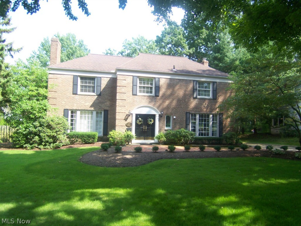 Price Dropped 50k!! What a find. This 4 bedroom 3 1/2 bath all brick center hall colonial sits on .6 acres of the some of the most prestigious landscaping in Akron. With winding walk ways, multiple patios, and amazing plant life, the rear yard is one of a kind. There is over 4000 square feet of total living space, with much of the flooring natural hard wood. A large living room opens to a beautiful morning room, and has one of the 3 fireplaces. The other is in the open family room with high ceiling that opens to a sun room. Each of the bedrooms is large, with a master suite and second floor laundry. The ample closet space is reflected throughout the home. The finished rec room is 22x14 in the lower level. Enjoy the wonderful landscape from the over sized deck and multiple patios. There is a 3 car garage, shed, first floor library, open foyer, large attic space, and so much more. There is way too much detail to list. Come see for yourself!!