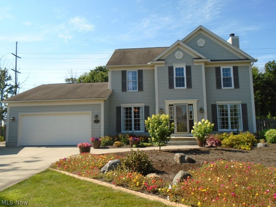 Meticulous Colonial with breathtaking landscaping awaits you in this spacious three bedroom home!  Expansive great room features new (14) carpet & attractive split log premium gas log insert, stone façade & glass doors to fireplace. Look forward to preparing meals in the large kitchen, updated in 2009 with high-end stainless Bosch oven/stove & Bosch dishwasher, countertops, under counter sink, fixtures & more.  Like to entertain? Share meals in the formal dining room or in the eat-in kitchen where you can take in the views of the stunning rear landscaping edged by decorative custom concrete borders. Step outside & sit in the shade under the aluminum Pergola on the huge patio or get cozy by the fire pit. If you like to garden, the raised garden beds are ready for you to try your green thumb!  The fully fenced backyard is your own private wooded oasis! All three bedrooms have new (15) neutral carpet.  The master suite has an updated bathroom with new (2015) custom tile work, all new fixt