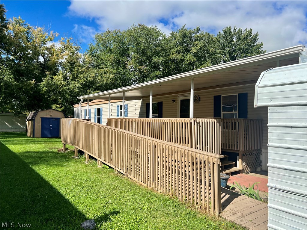 This home is one story living ready for a new owner. It features 3 bedroom, one of the bedroom being a master with its own bathroom and walk in closet. Open floor plan with updated kitchen and newer appliances. The other 2 bedrooms and full bath are on the opposite side of the master for privacy. The roof and central air were installed in 2020. Also features a large covered porch, with wheelchair ramp. There is also a shed and a 2 car carport. Great place for kids to play at the end of the park.