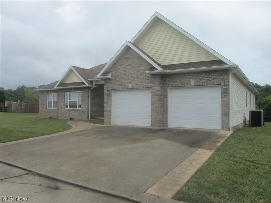 Absolutely beautiful home in move in condition.  The Great room with gas log fireplace has sliding doors that open onto a covered screened deck overlooking the large yard with wooded view.  The home boasts a spacious floor plan with split bedroom design offering 2 bedrooms with Jack and Jill bathroom.  Master bedroom with en-suite including a walk in closet,  jetted tub,  standing shower and double bowl sinks.  The kitchen has oak cabinetry and stainless appliances and a nook for casual dining.  There is a formal private living room and a formal dining area.  Laundry room with utility tub and oak cabinets, 200 amp electrical service, Hi Efficiency furnace and more.  Don't miss out on this wonderful home.