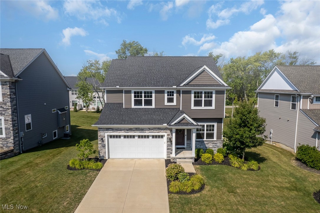 Welcome to this stunning, move-in ready 4 bedroom Colonial by Petros Homes, ideally situated on a quiet cul-de-sac street in Broadview Heights. You’ll be impressed by the stone-accented façade, carriage-style garage door, lush landscaping, and charming covered front entry that create exceptional curb appeal. Inside, the inviting foyer leads to an office/flex room, perfect for remote work or quiet relaxation. The open floorplan flows starts with the spacious living room, featuring a large picture window, custom built-in shelving, and a beautiful stone fireplace. The adjacent dining area connects to a gorgeous eat-in kitchen, complete with granite countertops, a stylish backsplash, a center island, walk-in pantry, and all appliances included; perfect for both everyday living and entertaining. A convenient half bath completes the main floor. Upstairs, the primary suite offers a peaceful retreat with a walk-in closet and private bathroom that features a walk-in shower and large double sink vanity. 3 more comfortable bedrooms share a full bath w/ double sink vanity, & 2nd floor laundry room adds everyday convenience. The finished basement(2021) provides an exceptional extra living space w/ garden windows that fill the area w/ natural light. It includes a custom-built wet bar, a full bathroom, and a bonus room that’s ideal for a guest bedroom, playroom, or home gym. The backyard is complete with a deck(2021) that’s perfect for hosting summer barbecues or simply relaxing. Outdoor lighting(2020), adds ambiance and charm. Located near easy access to parks, shopping, dining, and highways, all while being tucked away in a quiet, family-friendly neighborhood. Don’t miss your chance, schedule your private showing today!