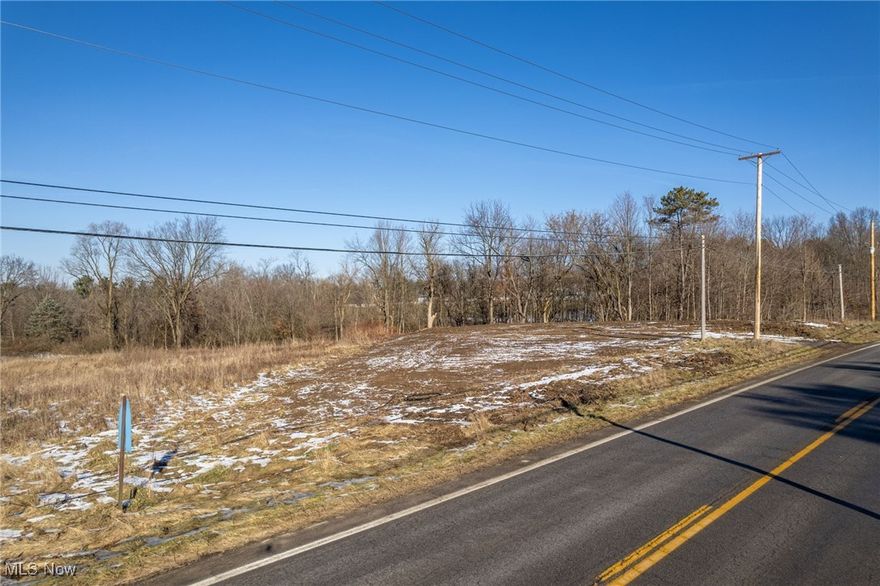 Prime land for building: Almost 1.5 cleared acres surrounded by trees and calming views of farm fields. Water/sewer/gas available, and electric already on lot. Low township taxes, quiet country feel, and minutes from 224/76/71. Bring your own builder and call today with any questions!