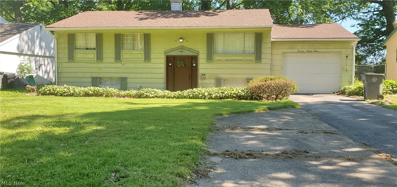Must See this 3-4 bedroom 1.5 bath Move-In ready Bi-Level Home. This home is well maintained and has a beautiful remodeled kitchen & main bathroom, tile & hardwood floors in main living areas. The primary bedroom has an additional bonus room attached (a great space for additional closet, office, craft room, den, etc.) Enjoy the additional space in the lower level which includes a half bathroom, bedroom with an additional rec/bonus/family rooms Enjoy the outdoors while utilizing the nice sized fenced in yard. Updated electric panel, hot water tank, furnace, roof 2019. Make your appointment today before it's gone! AS-IS! Seller's making no repairs.