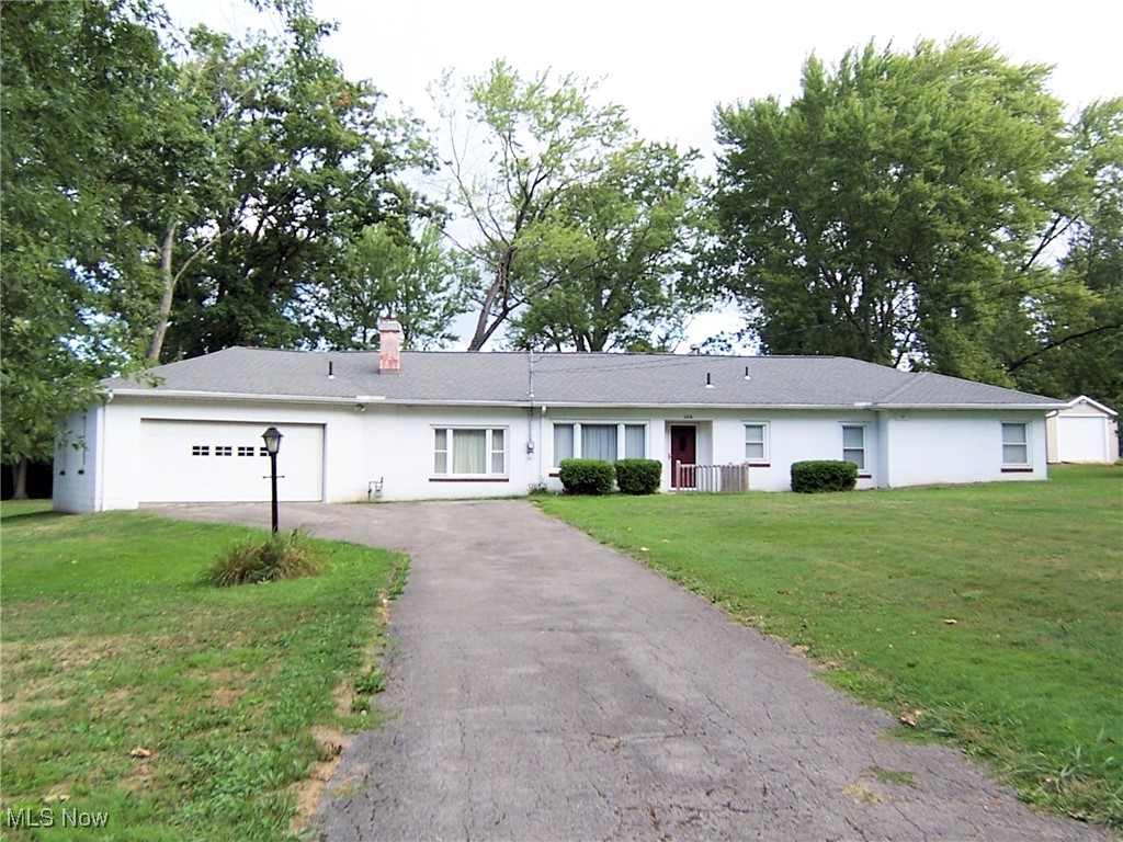 This sprauling ranch style home is situated on a large (135x299) lot and sits on Mathews Road between Southern Blvd and South Ave. It features 4 bedrooms and 1.5 baths plus a spacious living room, dining room area and a huge family room. The laundry room area is located off the kitchen hallway and has access to an enclosed area where you will find a stationary tub and hot water tank. This home is a slab but has plenty of storage with attic access, an oversized double garage and a room adjacent to the garage which features an overead single door and is perfect for storing the lawn equipment and outdoor furniture. Four bedrooms, a full bath and a half bath complete the layout. The kitchen includes the refrigerator and stove. The washer and dryer stay. The roof is appox. 10 years old. The windows are newer. Convenient location with easy access to major highways, shopping and restaurants.