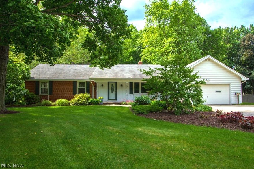 This mint condition, open floor plan ranch in quiet residential area of Mentor makes this 4 bdrm, 1-1/2 bath ranch a must see!  Large living room with crown moulding and gleaming hard wood floors is open to dining room with chair rail, crown moulding, hard wood flooring and slider to beautiful 3-season sun room for ease of entertaining.  Eat-in kitchen with ceramic tile, pantry, recessed lighting and all appliances is open to family room with gas fireplace and hard wood flooring; a perfect place for family gatherings. Two additional bedrooms on first floor are nice sized with double closets.  Fourth bedroom with built ins, double closet and additional storage areas is located upstairs in the finished dormer.  Oversized 2-car attach garage with pegboard and shelving has drain, electric and water.  Upgrades include hot water tank (Jan 2015), furnace (2009), replacement of front window and dining room slider.  Enjoy the serenity of the park-like backyard with  flower gardens and patio. Fi