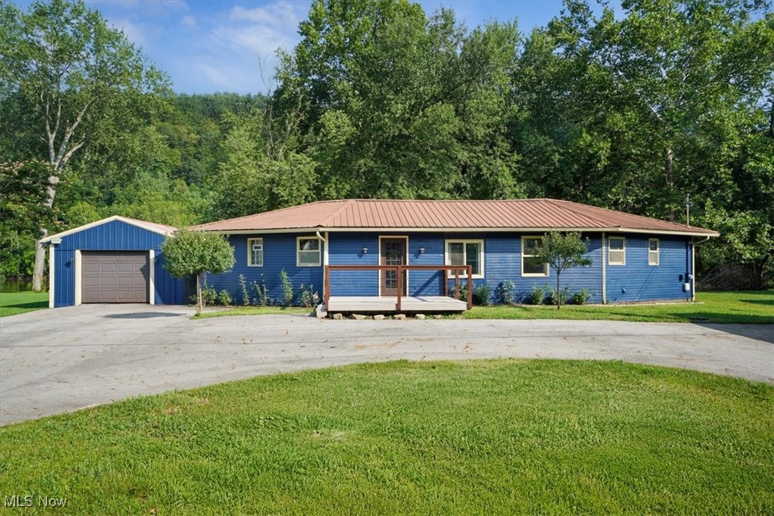 Welcome to this charming 2 bed, 2 bath ranch nestled right on the Muskingum Riveroffering the ultimate blend of comfort, functionality, and natural beauty. Wake up every morning to serene river views from every room, thanks to large windows that flood the home with natural light. Enjoy coffee in the 4 seasons sunroom, unwind on your private boat deck, or launch a kayak straight from your backyard. With a flat, open lot and mature trees lining the water, this home offers a peaceful, park-like setting you'll never want to leave. Inside, you'll find a thoughtful layout designed for easy living. The vaulted ceiling, open floor plan creates a cozy and connected space for entertaining. The two full bathrooms make it easy to host guests, while the dedicated mudroom is perfect for rinsing off after a day on the river or storing your outdoor gear. The detached outbuilding is large enough to store a boat or outdoor toys without taking away from your garage space, making this a practical choice for adventure seekers. And with many recent repairs, the property is move-in ready and easy to maintain. Whether you're relaxing at home, soaking up sunsets on the water, or welcoming short-term rental guests, this riverfront retreat offers endless potential. It's been a personally loved homeand now it's ready for its next chapter. Agent/owner.