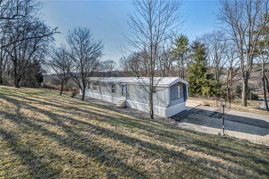 Discover the perfect blend of comfort and convenience with this fully furnished, turn-key 3-bedroom, 2-bath manufactured home, situated on a spacious 1.5-acre lot. Thoughtfully updated in 2024, this property features new countertops, an oven vent, modern furniture, and a beautifully remodeled primary bath. Additional upgrades include a brand-new alarm system, updated windows and doors, and new sewage and electrical installations.

Move right in with ease—everything you need is already in place! Located just ten minutes from shopping, state parks, a hospital, entertainment, and golf, this home offers both tranquility and accessibility. Whether you're seeking effortless one-floor living or looking to expand your investment portfolio, this opportunity is not to be missed.