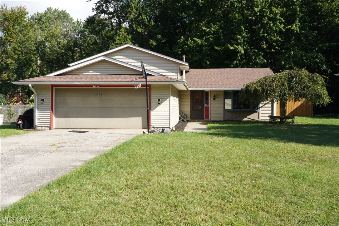 Welcome to this spacious 3-bedroom, 2 bath split-level home offering comfort and convenience in this desirable North Ridgeville neighborhood. Freshly painted on the main level, this home features luxury vinyl plank flooring with a transferable warranty and a bay window adding to the bright, open feel. The generous kitchen is designed for both everyday living and entertaining, complete with stainless steel appliances including a new refrigerator (2024), oven (2016), updated lighting and durable ceramic tile flooring. Dining room with modern ceiling fan is open to family room and conveniently leading to the large, fenced-in back yard. All bedrooms are enhanced with ceiling fans and the doors were just installed for a modern touch. The lower level offers a sizable laundry room with premium Nature Stone flooring and a new washer and dryer (2024). An enclosed, heated sunroom extends the living space year-round—perfect for relaxing or entertaining guests. Convenient location close to shopping, dining, and more. Home Warranty included for peace of mind. Don’t miss this opportunity to own a move-in ready home in a highly sought-after neighborhood. Schedule your showing today!