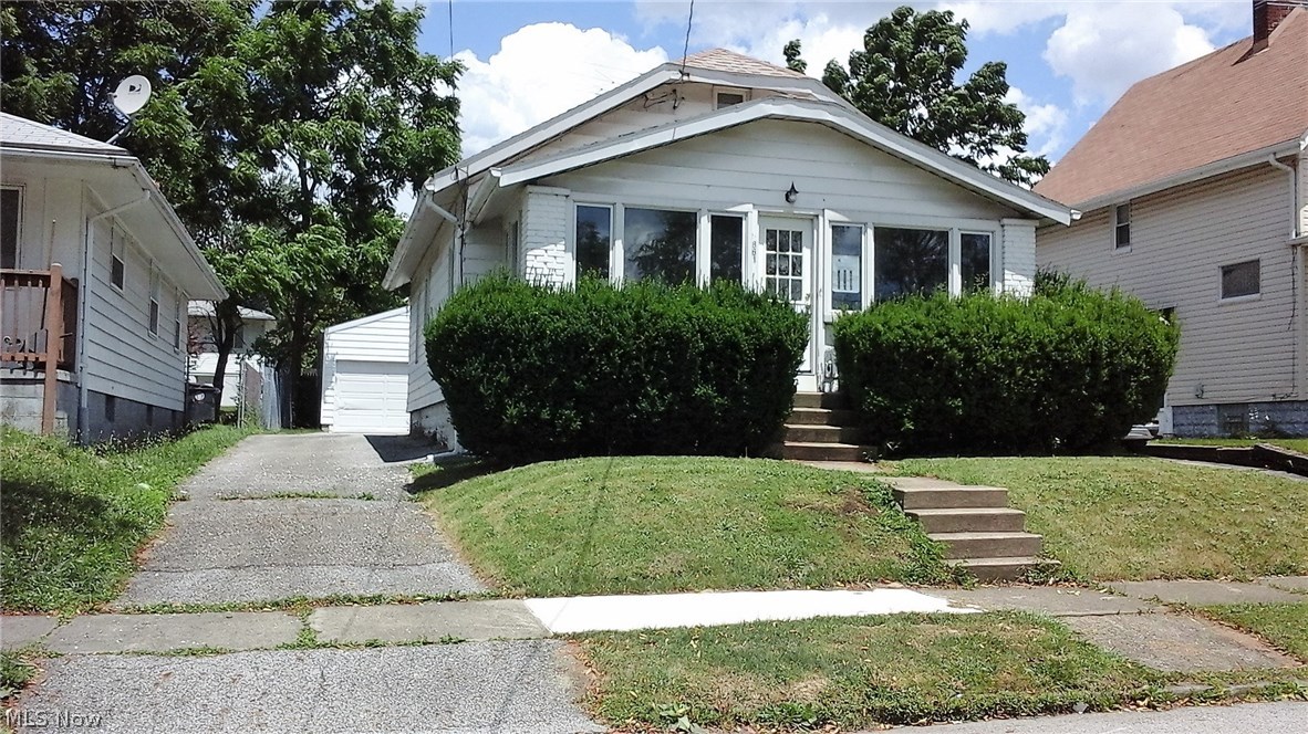 Move in ready brick & aluminum bungalow home, waiting for you! Has a private entrance for your own suite, or can be a family room, etc. Many choices! Has a walk in tub in master bath with wide doorway. Newer Anderson windows with screens. Lovely sun porch lets in great light! Upstairs is a finished space just waiting for your imagination! Cedar closet in one of the bedrooms. Great basement storage also! Water heater & furnace were new in 2013. Vented glass block windows in the basement. The washer & dryer stay! All this and a home warranty too! Motivated seller and the price is right! Come see your next home!