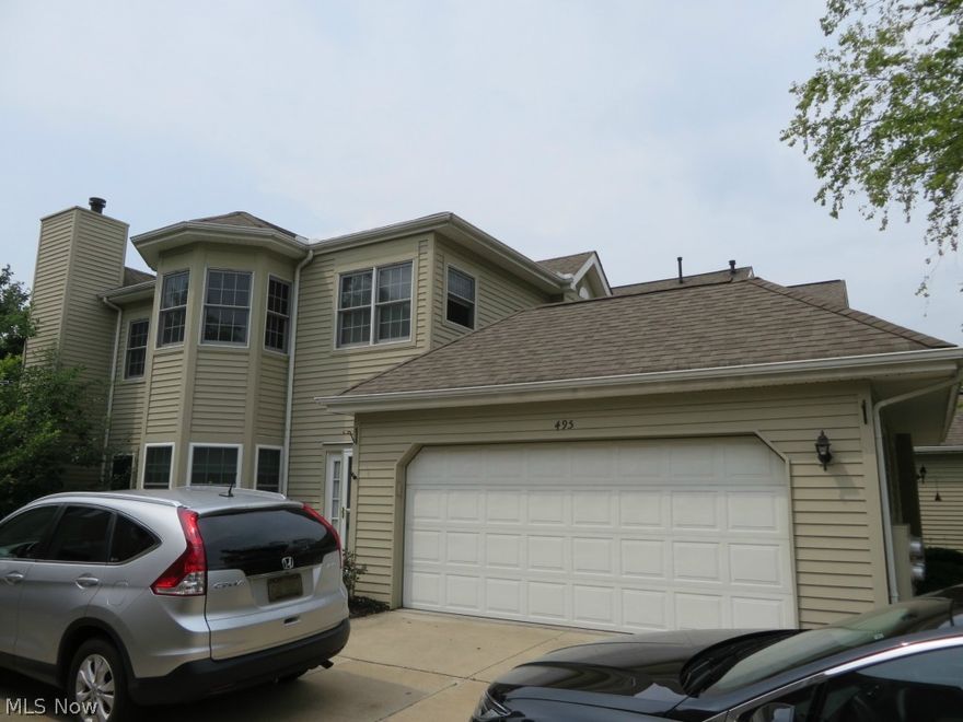 Move right into this Second Floor Ranch located in the upscale Condo Community, Woodhawk. All appliances including brand new washer and dryer. Kitchen has breakfast bar. Great room has vaulted ceiling, gas fireplace, private balcony porch, and staircase to loft. The loft can be possible 3rd bedroom with double closets and skylights. Large master suite has vaulted ceiling, walk in closet and glamour bath with double vanity, soak tub and shower. 2 car attached garage with plenty of cabinets, counter space and Naturestone floor. Woodhawk amenities include 24/7 attached Gatehouse and two heated swimming pools. Freshly painted interior. two new storm doors.  One Year Home Warranty. Immediate Occupancy!