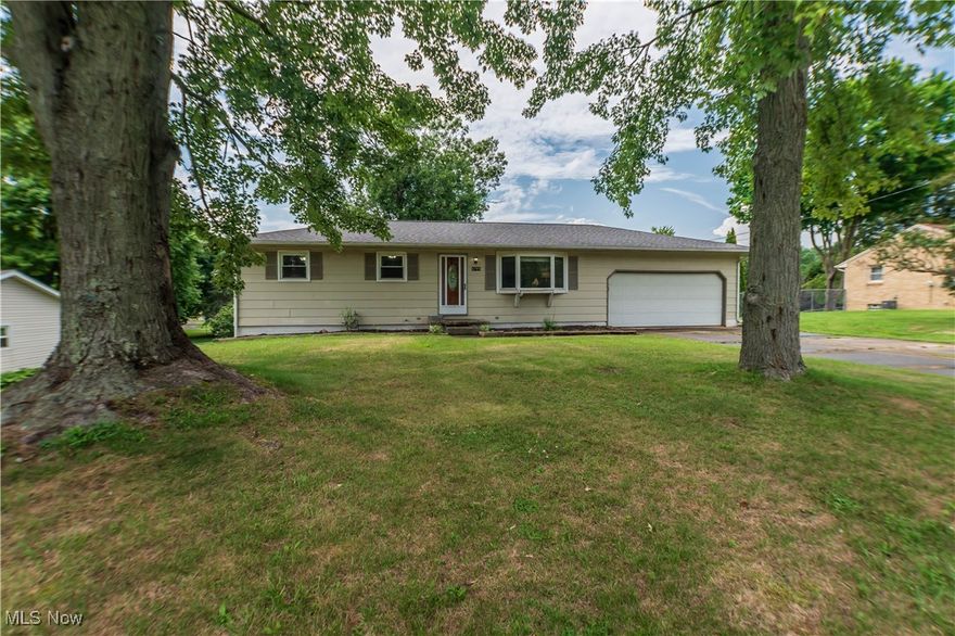 Welcome to this charming ranch style home located at 6795 Pinetree Ave NE in Canton, OH. Step inside to discover a cozy interior with three bedrooms and one full bath on the main floor. The open-concept layout offers a seamless flow between the living room, dining area, and kitchen, creating the perfect space for everyday living and entertaining. This home features all new LVT waterproof floors and fresh paint throughout. Another highlight of this home is the walk-out basement that leads you to the fenced-in backyard. Imagine enjoying your morning coffee on the deck while overlooking the peaceful surroundings of the park that borders the backyard. With an additional two car garage on a double lot, there is plenty of space for storage, and outdoor activities. Call Brandon to schedule a private showing today !
