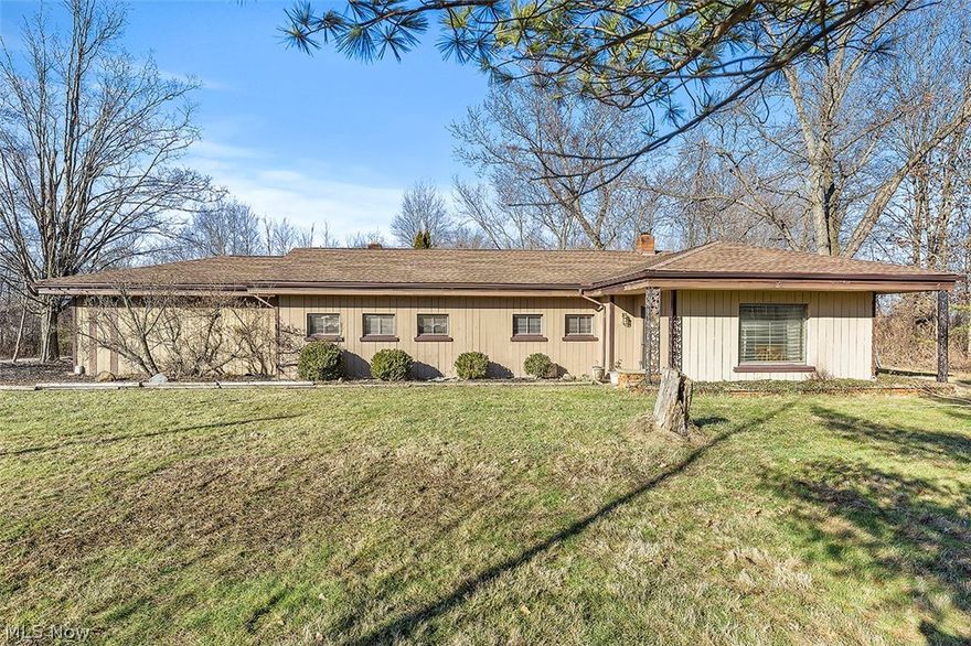 A well built concrete block home, great bones.  Solid and functional, in need of some TLC, and cosmetic updates inside the home. situated on two acres.