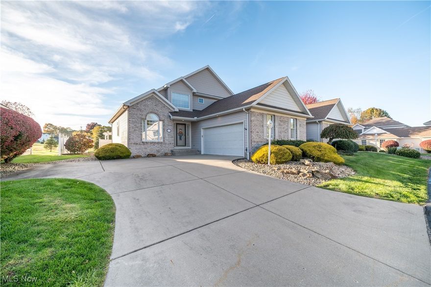 Welcome home to this beautiful two story condo in the heart of Poland where low maintenance living meets inviting warmth and everyday comfort. From the moment you walk in, you will love the open and airy feel of the vaulted great room with its rich hardwood floors, gas fireplace, and natural light pouring in through the tall windows. The first floor includes a dining room, eat in kitchen, and spacious living room that flow seamlessly together. The kitchen offers stainless steel appliances, light cabinetry, plenty of counter space, and a breakfast bar perfect for casual dining or entertaining. The dining area is bright and open, creating an ideal layout for gatherings. The first floor primary suite provides convenience and privacy with a walk in closet and private bath that features a soaking tub and separate shower. A half bath and laundry room are also located on this level, allowing for complete one floor living if desired. Upstairs you will find an additional bedroom, a full bath, and a versatile loft area that works perfectly as an office, reading nook, or guest space. A full, open basement provides endless potential for finishing or storage, while the attached two car garage adds practicality and convenience. Outside, the private stone patio overlooks a peaceful meadow that fills with wildflowers each spring and summer, creating a tranquil backdrop for morning coffee or evening relaxation. Located minutes from Poland Village, shopping, and dining, this move in ready condo combines easy living with timeless comfort.