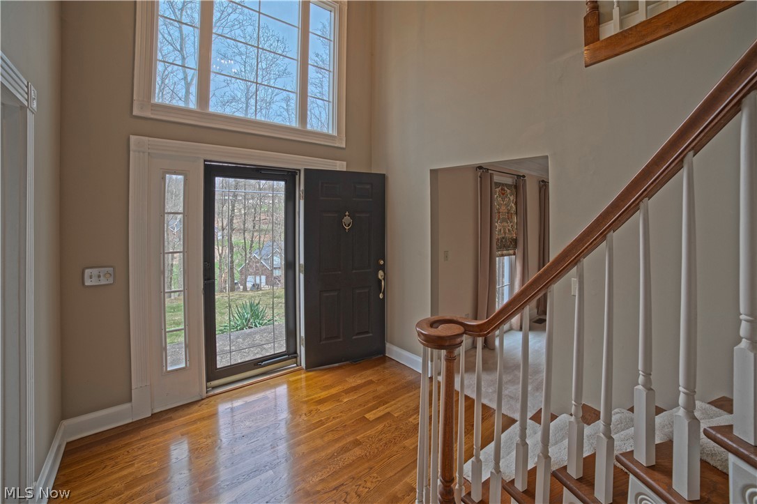 TOWN and COUNTRY location offers private 1.5 ACRE park like setting in desirable Brentwood Subdivision. This livable floor plan is a mix of STYLE and COMFORT in over 3,200 square feet. Two story entry with upper level gallery leads to spacious rooms with volume ceilings and oversized windows that give views of the treed grounds. The first floor features guest accommodations, living and dining rooms, Fireside Great room opens to custom kitchen with furniture styled cabinetry, new appliances and vaulted morning room. Second floor owners suite has trayed ceilings and ample bath with walk in shower, bidet, soaking tub and walk-in closet. Two additional bedrooms, second full bath, laundry and family/media room. You will appreciate newly refinished hardwood flooring, neutral interior painting, upgraded HVAC system and TOTAL maintenance free exterior. Outside, the property has a covered patio, raised terrace, additional parking, three car garage and private drive. Community pool and tennis. T