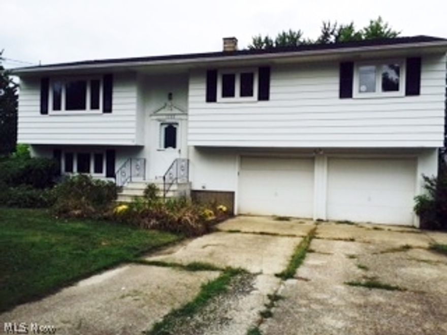 Oh My!  You could be the Lucky Winner in this spacious and updated family home in Grafton nestled on a treed lot with 4 spacious bedrooms, 3 full baths, formal dining room, spacious kitchen, a lower level roomy family room with a teen suite that could be the talk of the neighborhood.  A spacious and deep double car garage.  A queen sized fenced yard with two storage barns.  1860 square feet of living space on 2 levels.  Master suite has it's own private deck and full bath.  You will certainly appreciate the easy flow of the floor plan. Pella windows. Roof complete tear-off 2012 w/30 year shingles. New exterior paint 2012.  New counters, interior paint, carpet and vinyl 5/13. Even though there is updated carpeting in this family home, there are hardwood floors under the carpet in the DR, LR and 3 bedrooms on the main floor.  Gas heat, Central air.  A one year Home Warranty is being offered by the sellers. Cruise to shopping, zip to work with all the main roads close by.