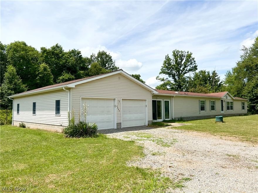 Over 1.3 comfortable acres.  Ranch style living with 4 car garage!.  Welcome to this spacious home in Western Reserve School District.  Offering a FULL basement to include a total of over 4700 sq ft!  This home has 3 bedrooms, 2 full baths, living room, dining room, eat-in kitchen, family room with fireplace, breezeway between house and garage and unfinished basement with some rooms framed in and even plumbing started for and extra bathroom.  Some TLC needed to make this your home-sweet-home and with it comes opportunity.  Schedule your tour today!