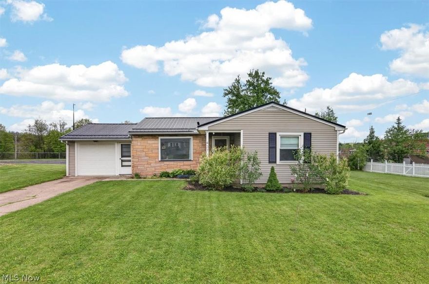 Charming 3-bedroom, 2-bath ranch in Girard, OH — move-in ready and beautifully updated. This single-level home features refinished hardwood floors, a bright open layout, gas fireplace, and modern finishes throughout. All appliances are included. Major recent improvements include a new metal roof, new furnace and A/C, new hot water heater, new appliances, all new siding, new garage door and opener, and upgraded attic insulation for improved efficiency. Comfortable attached garage and low-maintenance exterior make this a great choice for buyers seeking reliability and convenience. Schedule a showing today!