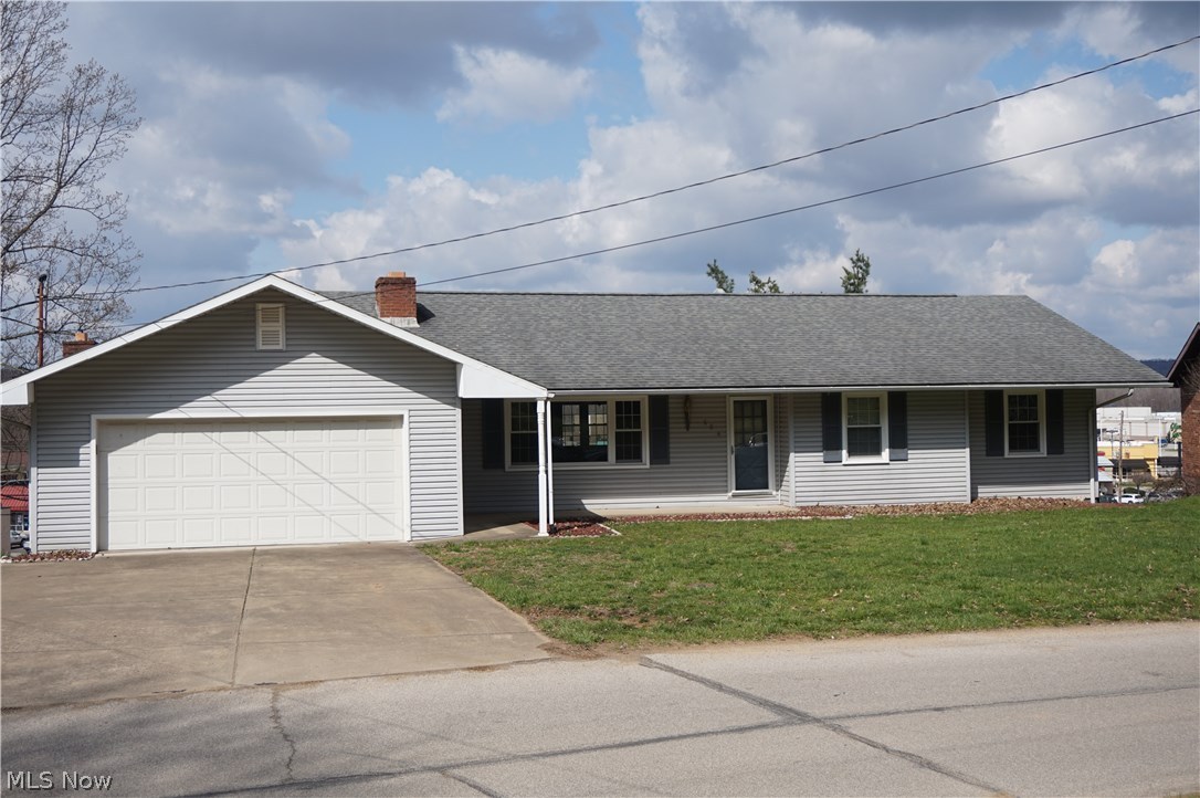 JUST MOVE IN. First floor living. Open floor plan with a city view. This house has so many updates. Newer three dimensional roof, windows, and doors. Updated kitchen with solid countertops, newer floors. Composite deck. Newer flooring. Two fireplaces. There is also approx. 698 sq.ft. unfinished area in the walk out basement.