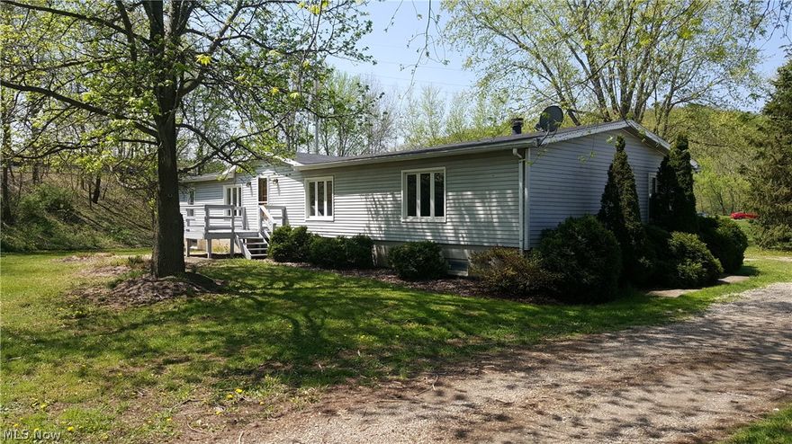 Open concept manufacture home with fireplace on county setting. Efficient electric heat pump. 1st floor laundry. Is on a permeant foundation. Partially finished basement. Taxed as real estate.